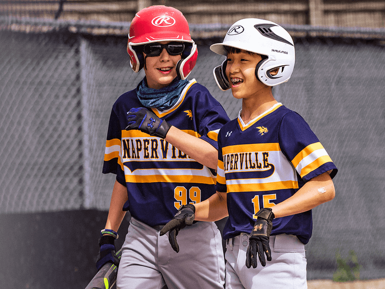 Youth Baseball Players Laughing Together